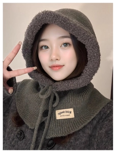 Detail of grey knitted balaclava hood with thick fleece lining and button drawstring