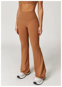 Detail showing the brown high-waisted flared yoga pants and elastic matte texture
