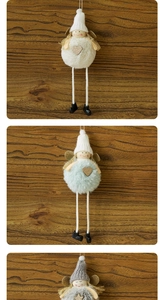 Close-up of plush angel ornaments with long legs and gold wings for Christmas trees