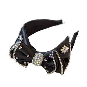 Luxury black satin headband with rhinestone bow and sparkling crystal star embellishments