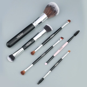 6-piece makeup brush set including powder brush and double-headed eyebrow tool on gray background