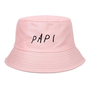 Close-up of pink cotton bucket hat featuring black PAPI embroidery and twill texture