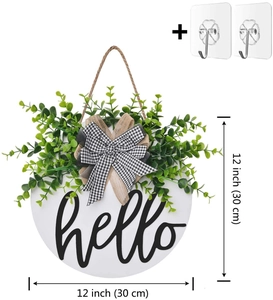 Close-up of 12-inch hello wooden wreath with greenery and buffalo plaid bow details