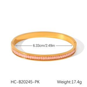 Detail view of 18K gold plated stainless steel bangle with pink zircon inlays and dimensions
