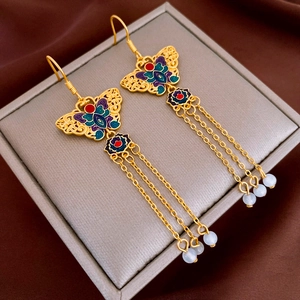 Elegant gold butterfly earrings with colorful enamel wings and long beaded tassels