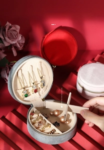 Macro view of portable velvet jewelry box with necklace hooks and flexible dividers