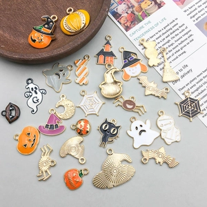Flat lay of colorful Halloween alloy enamel charms featuring pumpkin and ghost designs
