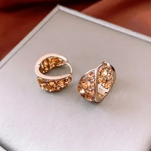 Orecchini a cerchio a U dorati vintage con pavé di cristalli champagne