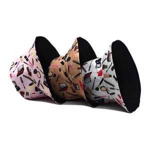 Women's reversible bucket hat with cosmetic prints in pink, beige and white colors