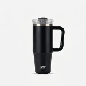 Detail of a 40oz black matte stainless steel insulated tumbler with a sturdy handle and straw