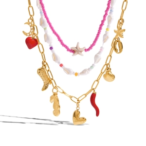 Bohemian multilayer necklace set with gold charms, pink beads and starfish shell pendants