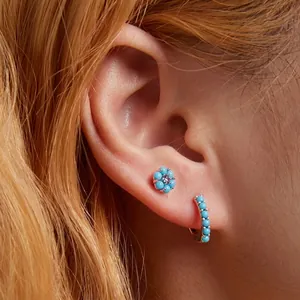 Bohemian 925 silver stud earrings with turquoise flowers and crystal ear cuffs on model