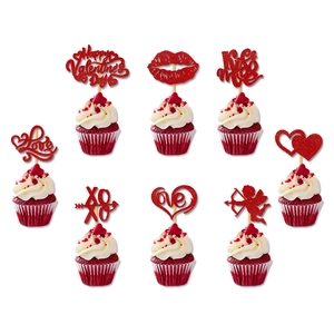 Detailed view of red glitter Valentine cupcake toppers with Love and XOXO designs