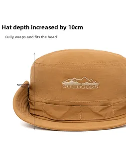 Detail showing the 10cm depth and outdoor mountain embroidery on the brown cotton hat