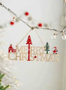 Detail of wooden Merry Christmas sign with Santa and tree on a glowing holiday branch