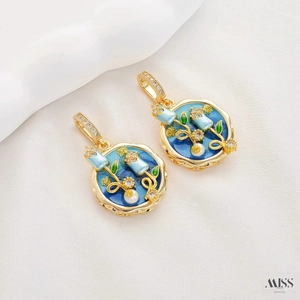 Macro view of vintage enamel floral pendants with pearls and zircon inlay
