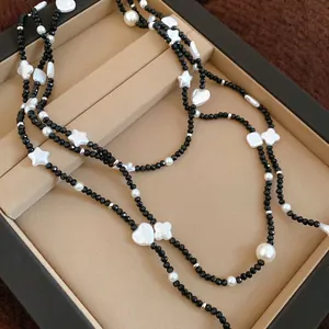 Elegant beaded star and pearl layered necklace with black faceted beads and vintage pendants