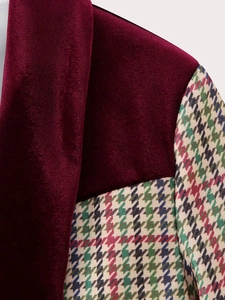 Detail of wine red velvet collar and multicolor houndstooth patchwork on a blazer