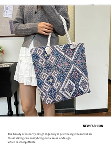 Detailed macro view of ethnic embroidered canvas tote with geometric patterns and rope handles