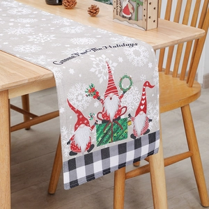 Christmas gnome table runner with linen texture and plaid edges for holiday dining decor