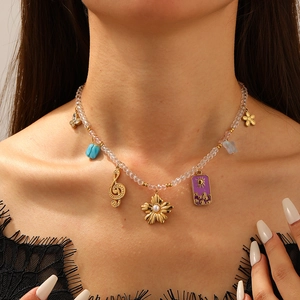 Retro Y2K choker with clear beads and vintage sun flower charms on a model