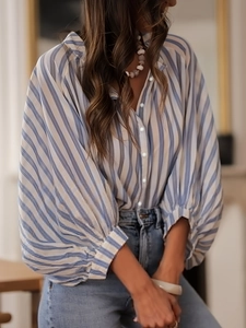 Relaxed blue and white vertical striped women's long sleeve blouse with pearl buttons