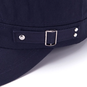 Detail of navy cotton twill flat top cap with silver metal buckle and rivets
