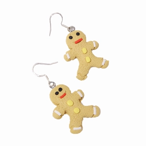 Detailed view of gingerbread man earrings with frosted texture and festive Christmas patterns
