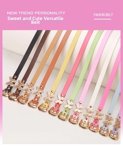 Close-up of slim colorful belts featuring a golden butterfly metal buckle and PU leather finish