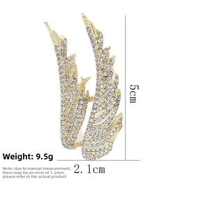 Detailed view of rhinestone angel wing brooch with dimensions 5cm height and 2.1cm width