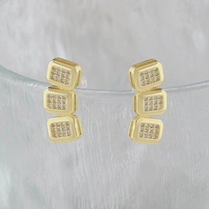 Minimalist gold square stud earrings with vertical cubic zirconia rectangles on glass