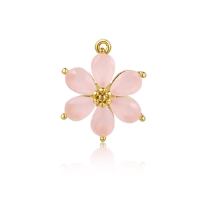 Macro detail of pink flower pendant with gold core and matte resin petals for jewelry making