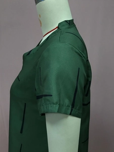 Detail view of dark green short sleeve dress with minimalist black geometric lines pattern