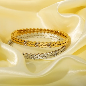 Elegante set di bracciali a foglia in oro 18 carats e argento con brillanti zirconi