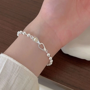 Minimalist 925 sterling silver beaded bracelet with central pearl eye motif charm