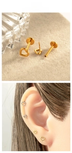 Macro shot of titanium heart hollow stud earring with flat back labret piercing detail