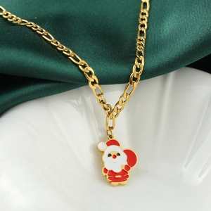 Festive Santa Claus necklace with red enamel and gold chain on green satin background