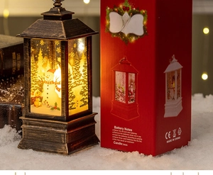 Detail of Santa LED storm lantern with red gift box and festive bokeh lighting background