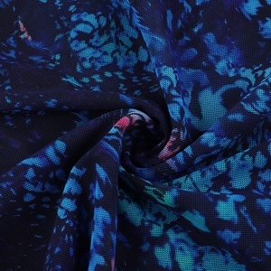 Close-up of lightweight mesh fabric with abstract dark blue and purple printed patterns