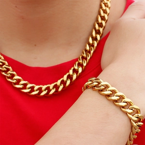 Polished golden stainless steel Cuban link necklace and bracelet set for men