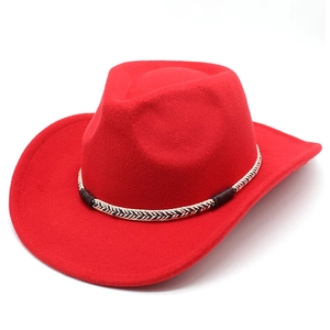 Detail of red cowboy felt hat featuring a woven decorative band and curved brim