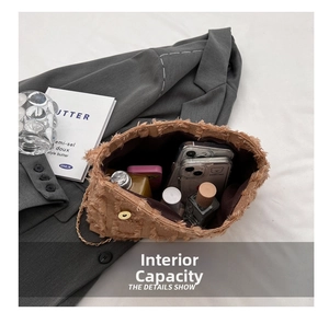 Internal view of brown textured crossbody bag showing capacity for phone and perfume