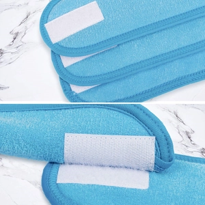 Close-up of blue headband fabric texture and white adjustable hook and loop closure