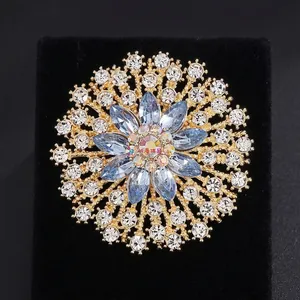 Exaggerated retro sky blue glass crystal flower brooch in gold finish for women