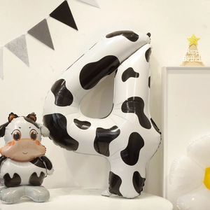 Detail view of a 40-inch cow print number 4 foil balloon for animal theme party decor