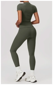Close-up of quick-dry dark green yoga top with slim fit tailoring and stretch fabric