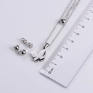 Three-piece stainless steel jewelry set featuring butterfly pendant and bead earrings