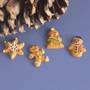 Miniature Christmas resin charms featuring gingerbread, tree, and snowman on purple backdrop