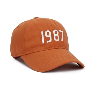 Classic 1987 embroidery baseball cap in caramel brown with curved brim and 6-panel design