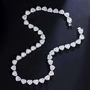 Detail of silver heart-shaped Cuban link necklace with iced-out pave zircon setting